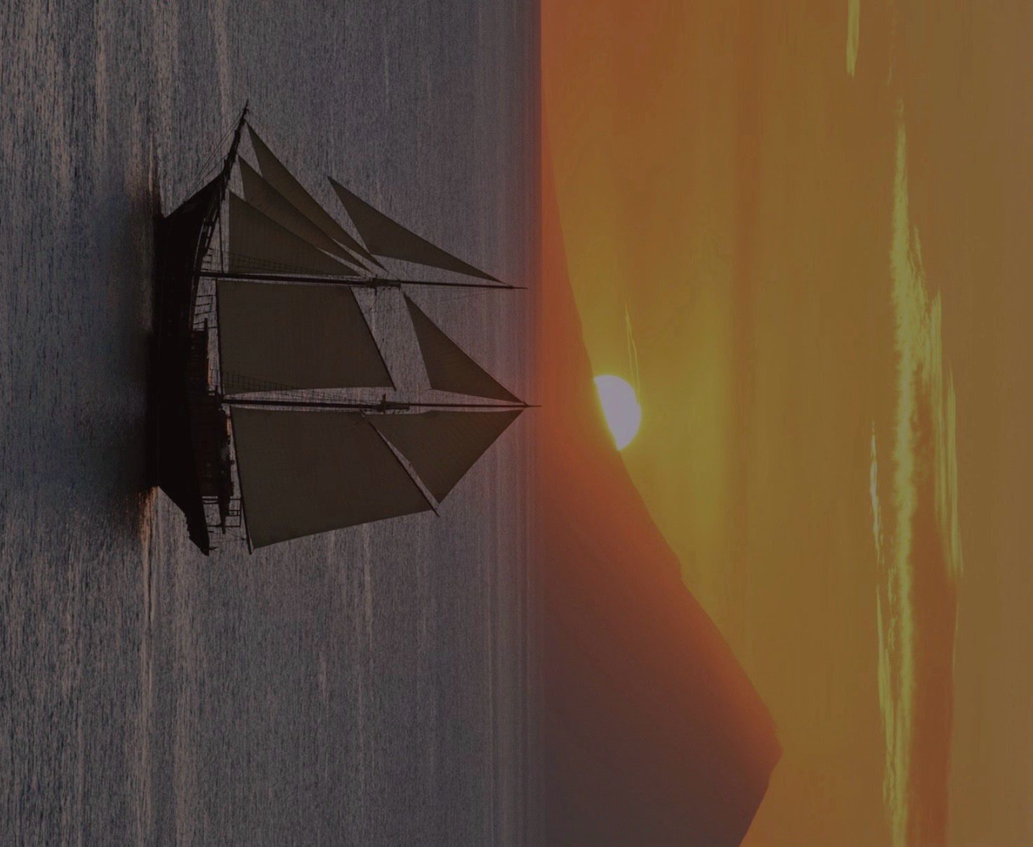 Sailing vessel at sunset for invitation-only strategic access experiences