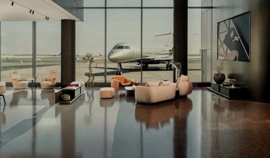 Private lounge with a jet on the tarmac outside