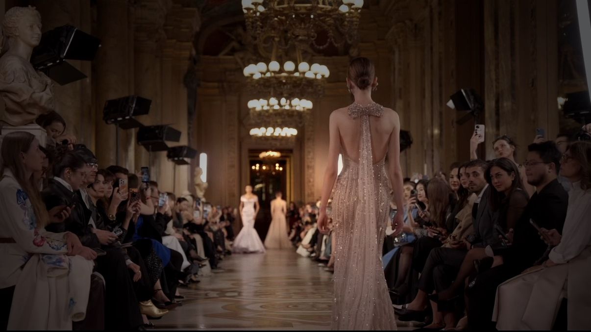 Fashion runway event in a grand hall for strategic private access experiences